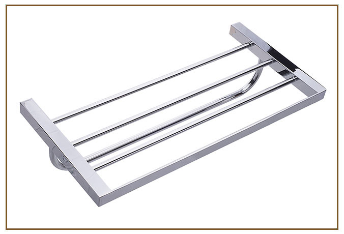 Toalheiro Rack TOALHEIROS RACK Linarte — Toalheiro rack em metal cromado, com prateleira de barras paralelas sobre estrutura de perfil quadrado e barra frontal…
